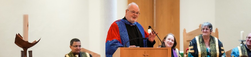 Fr Denis Blackledge delivers his Senior Fellowship address from the lectern of Liverpool Hope University chapel.